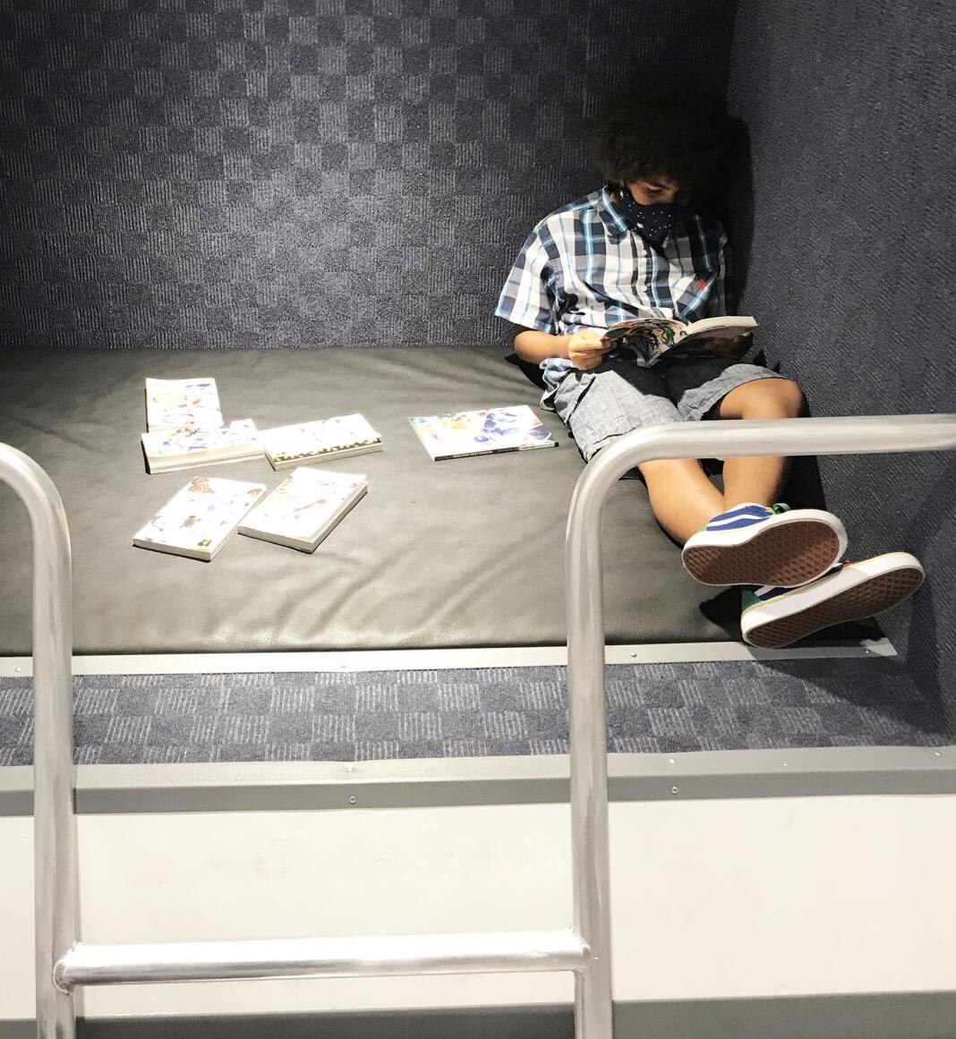 Nathaniel loved exploring the Cybrarium. He found a quiet reading nook to explore some good books.
